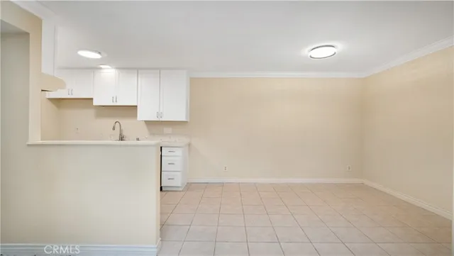 a view of kitchen with a sink cabinets and wooden floor