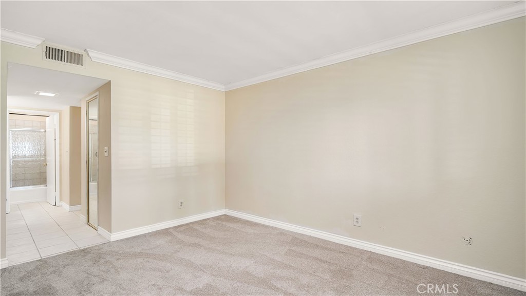 17522 Vandenberg Lane, Unit 3 Tustin, CA 92780 - Photo 22 of 27 an empty room with a workbench