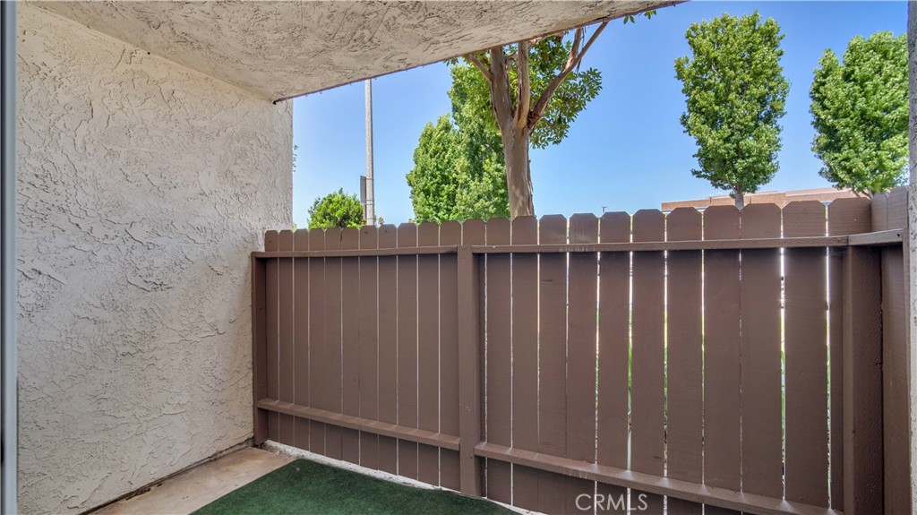 17522 Vandenberg Lane, Unit 3 Tustin, CA 92780 - Photo 26 of 27 a view of a backyard with wooden fence