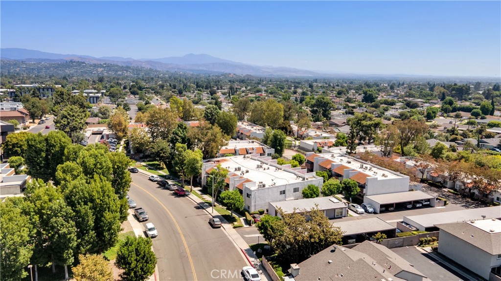 17522 Vandenberg Lane, Unit 3 Tustin, CA 92780 - Photo 5 of 27 an aerial view of a city with lots of residential buildings