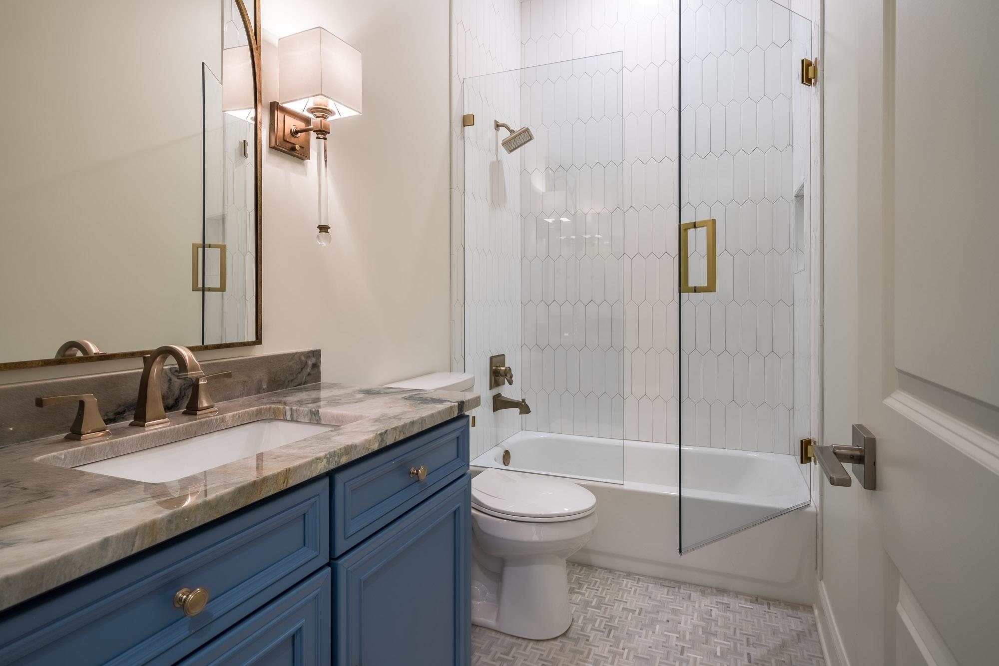 4099 Barfield Road Memphis, TN 38117 - Photo 14 of 25 a bathroom with a granite countertop sink toilet and shower