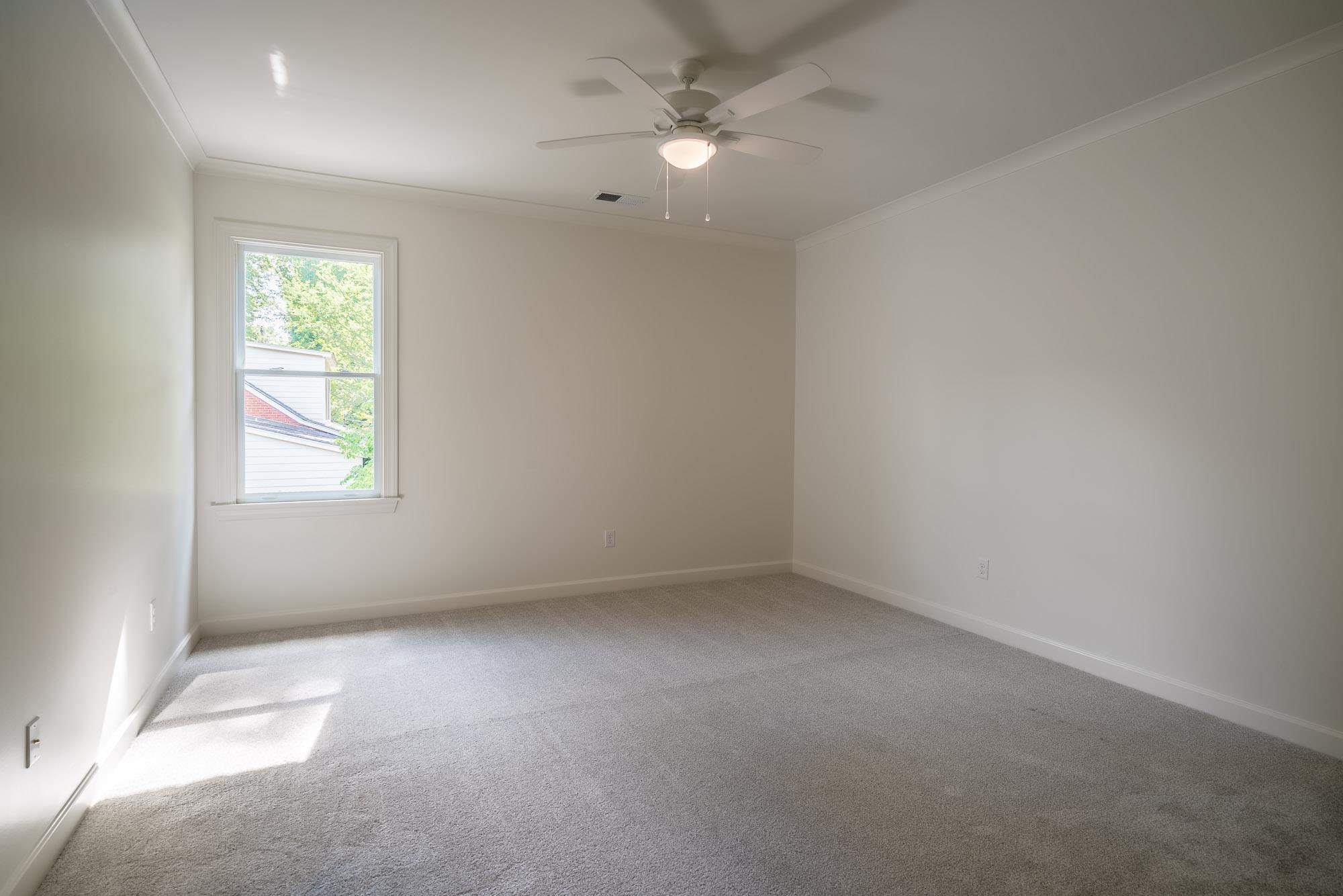 4099 Barfield Road Memphis, TN 38117 - Photo 15 of 25 an empty room with a window and ceiling fan