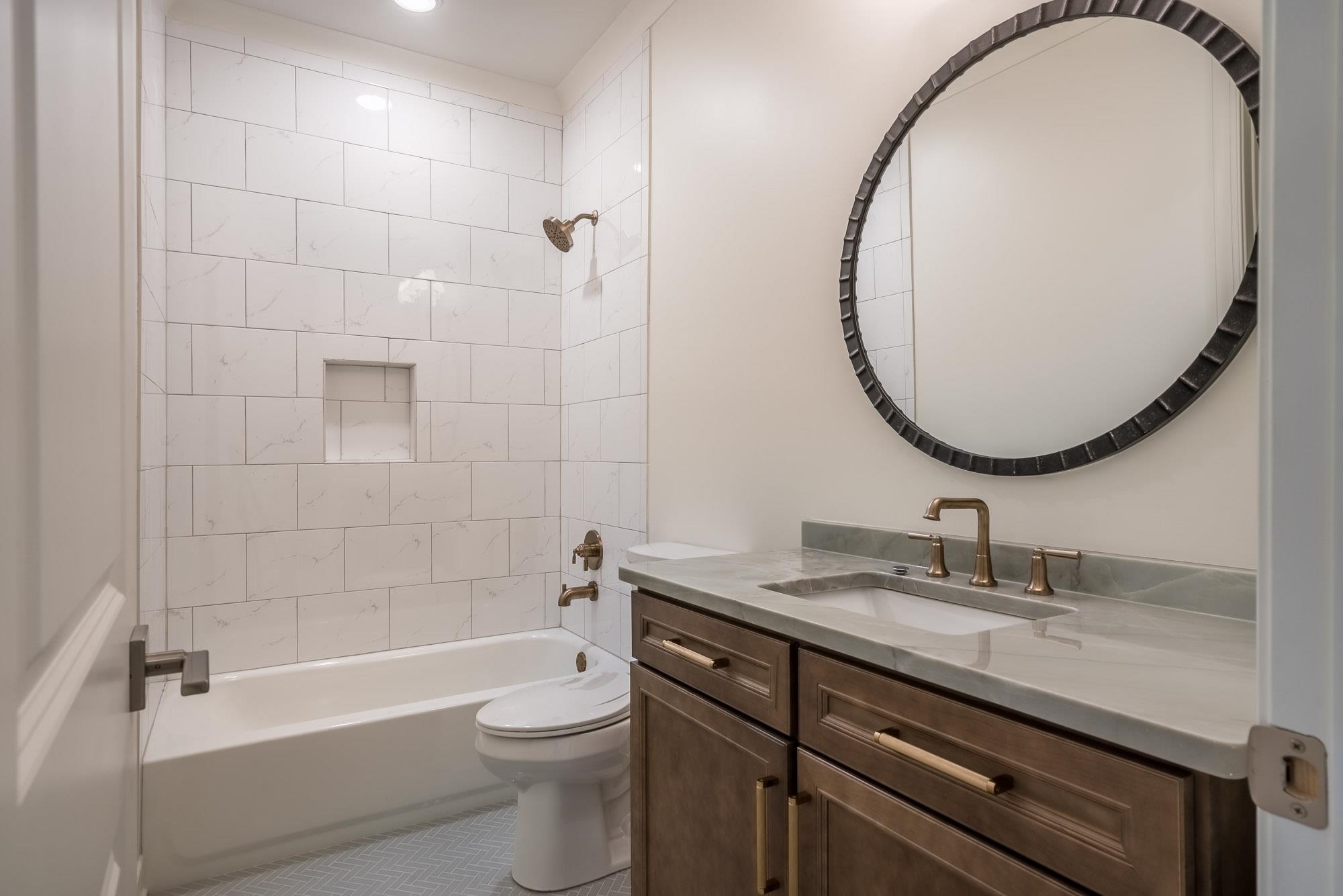 4099 Barfield Road Memphis, TN 38117 - Photo 16 of 25 a bathroom with a sink a toilet and a mirror