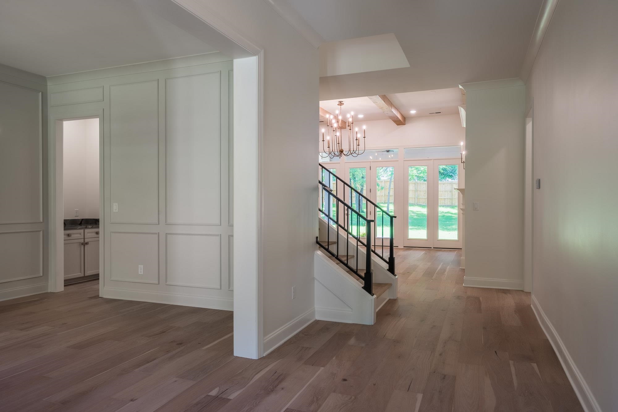 4099 Barfield Road Memphis, TN 38117 - Photo 2 of 25 a view of a hallway with wooden floor and stairs