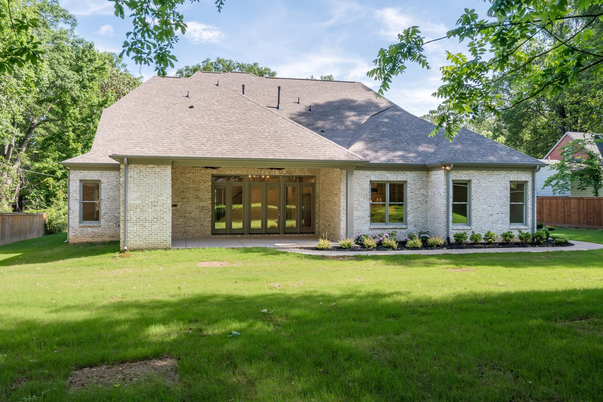 4099 Barfield Road Memphis, TN 38117 - Photo 22 of 25 a front view of a house with a garden
