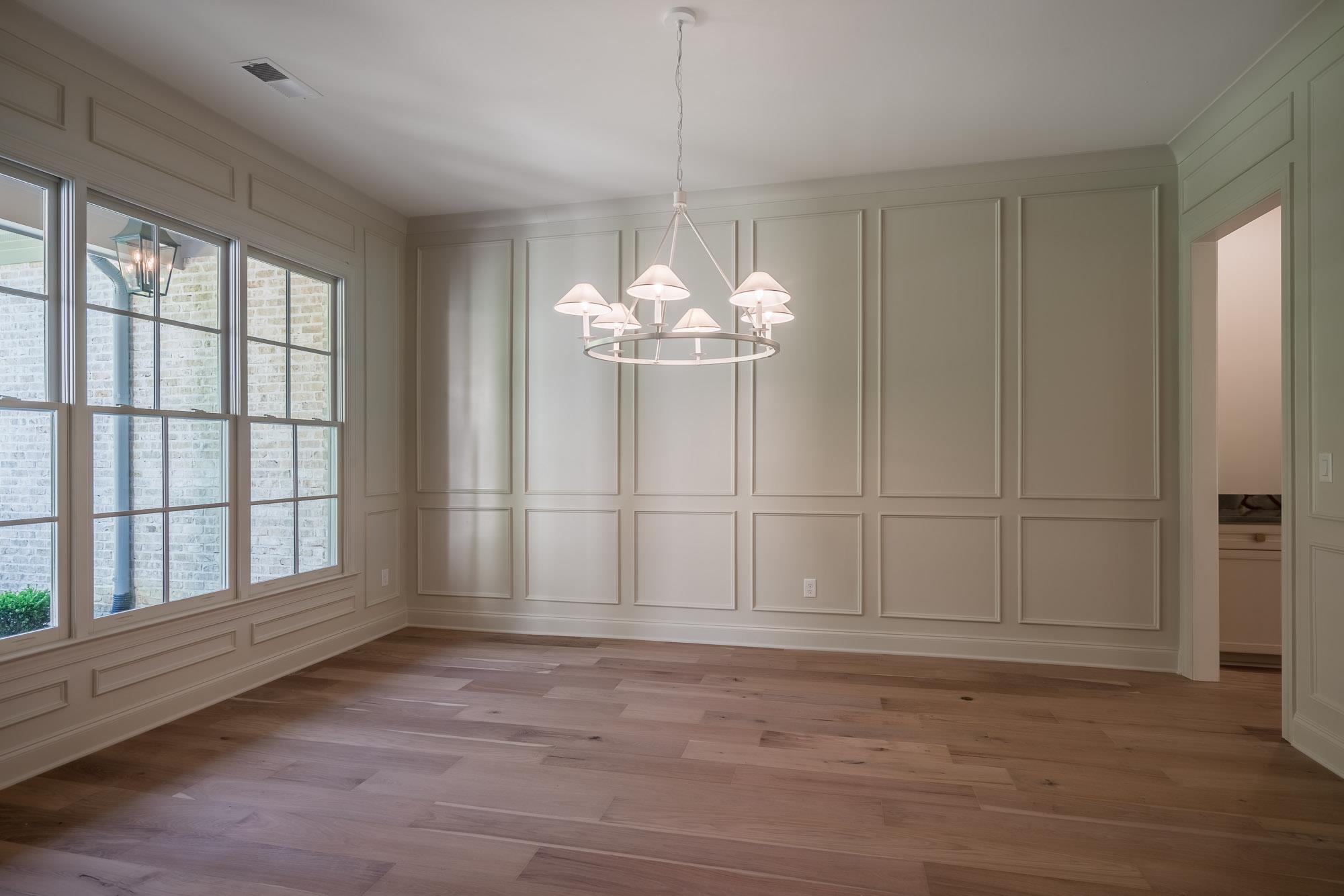 4099 Barfield Road Memphis, TN 38117 - Photo 4 of 25 a view of a livingroom with a chandelier wooden floor and chandelier