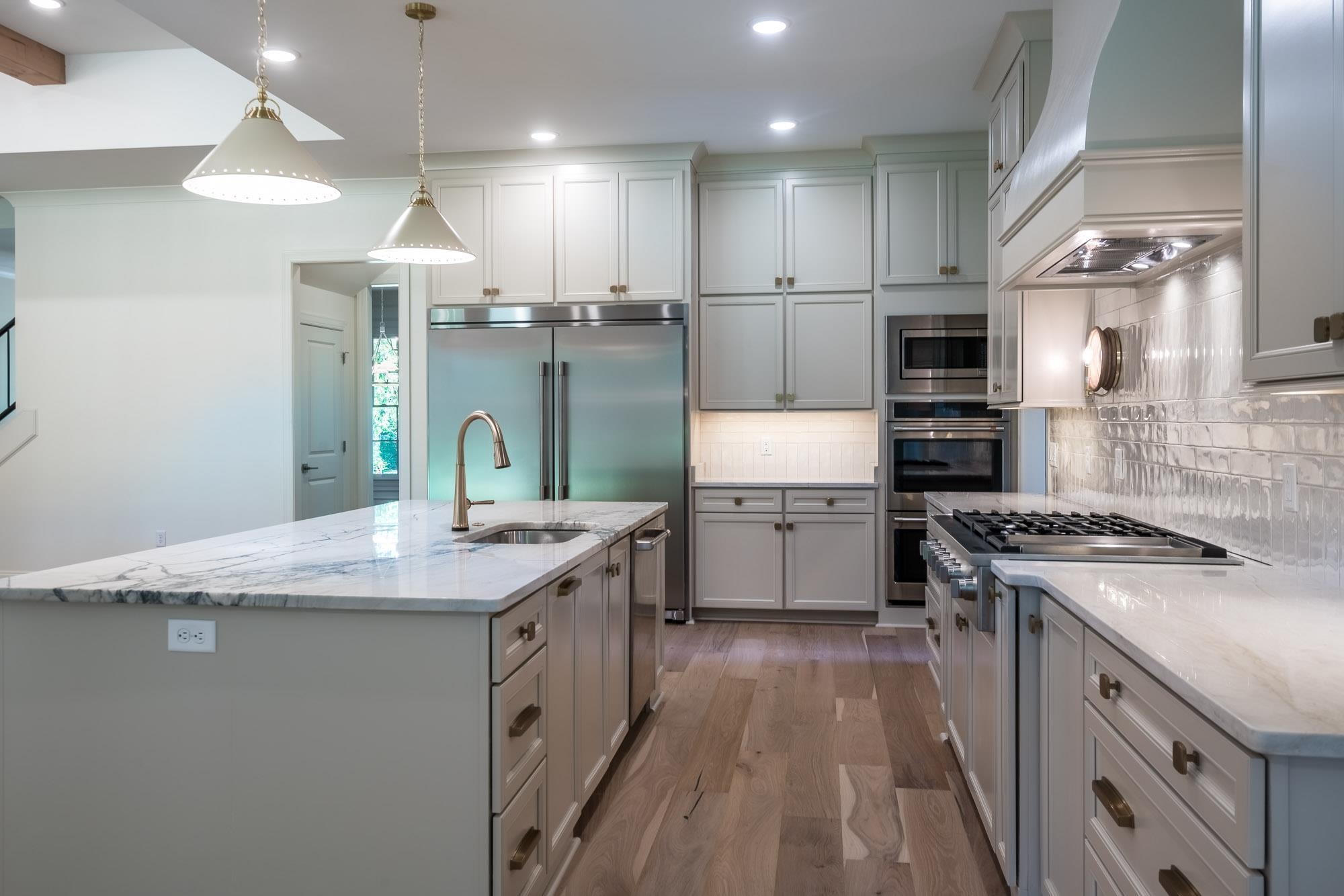 4099 Barfield Road Memphis, TN 38117 - Photo 7 of 25 a kitchen with stainless steel appliances granite countertop a sink stove and refrigerator