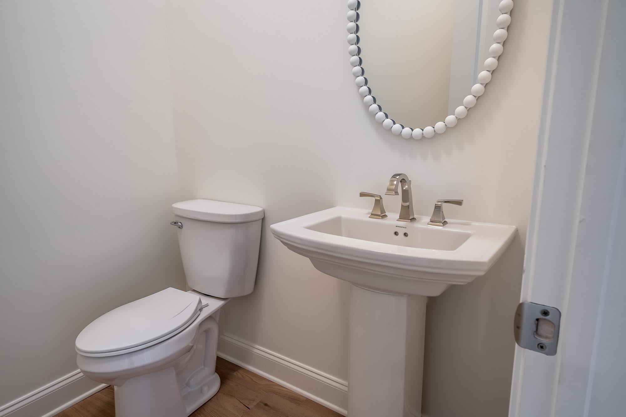 4099 Barfield Road Memphis, TN 38117 - Photo 8 of 25 a bathroom with a sink a toilet and a mirror