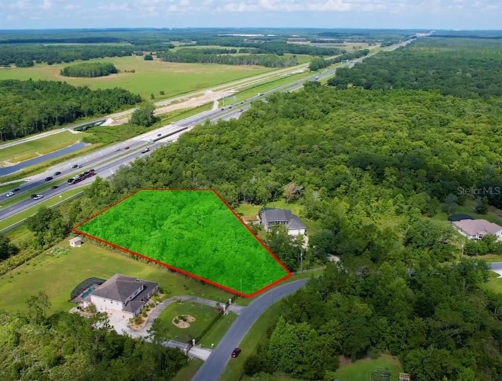 32 Starry Street Orlando, FL 32833 - Photo 3 of 8 an aerial view of a golf course with a park
