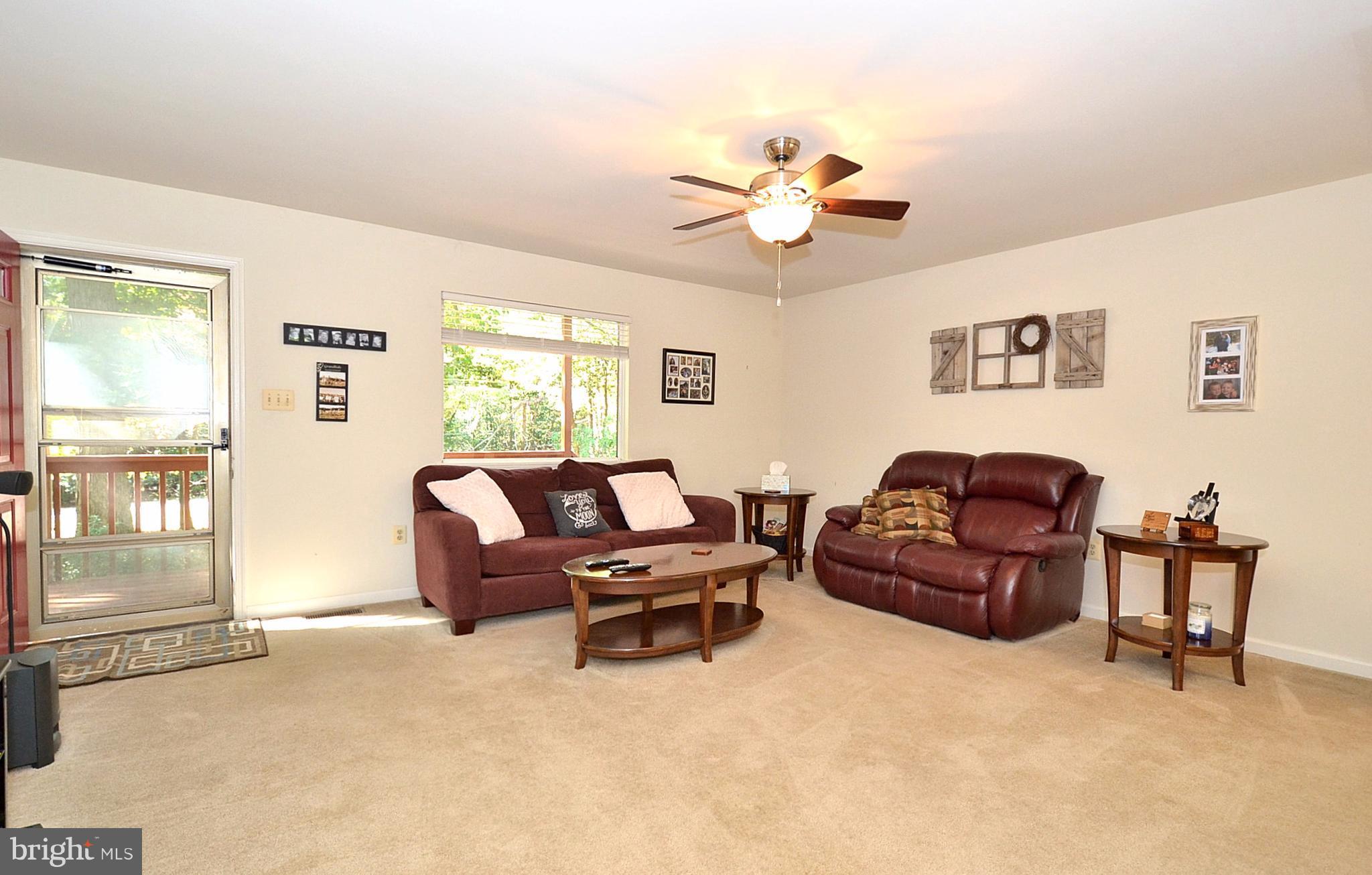 48126 Post Oak Road St. Inigoes, MD 20684 - Photo 3 of 16 Living Room w/ picture window view of wooded lot.