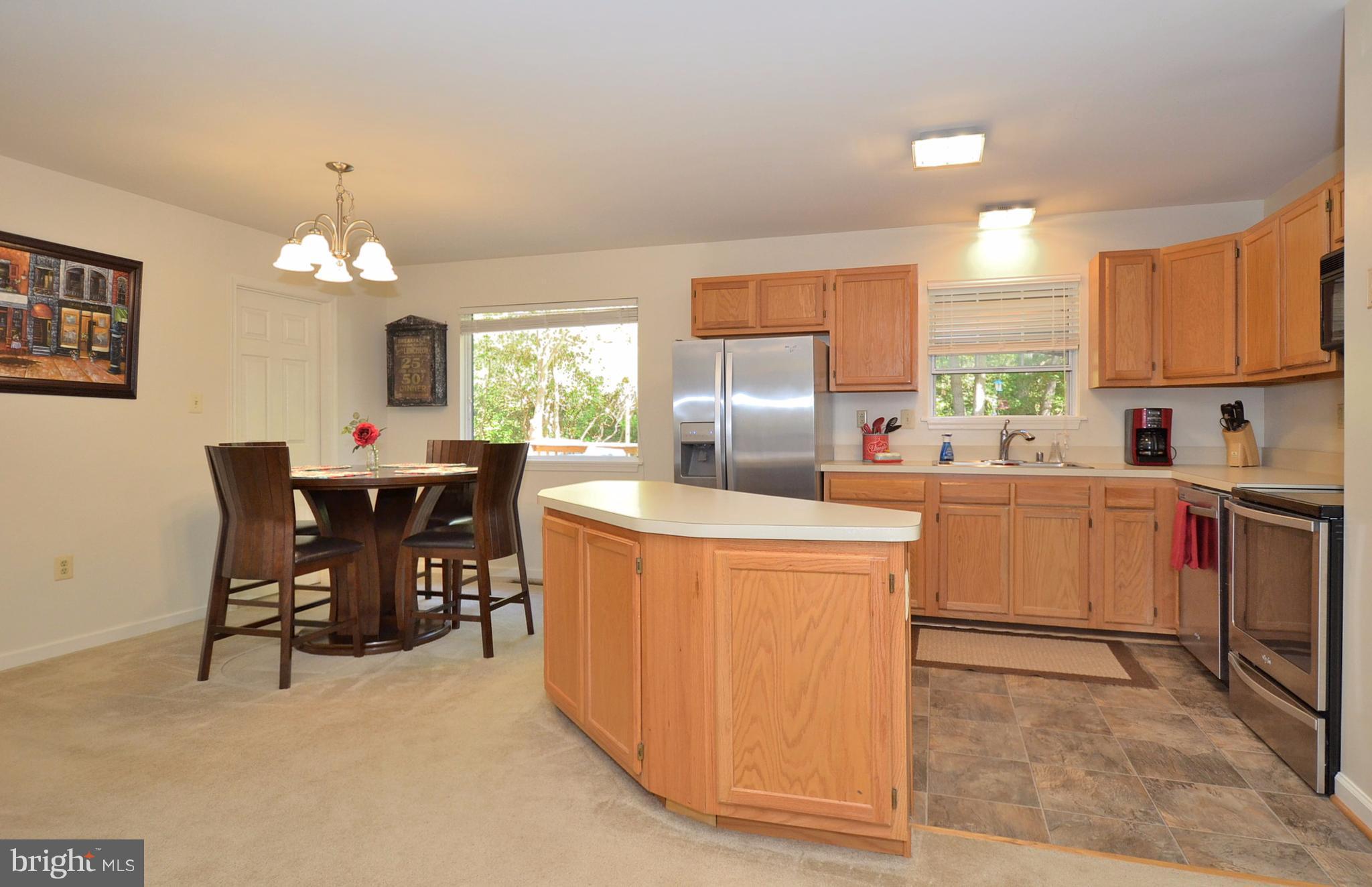 48126 Post Oak Road St. Inigoes, MD 20684 - Photo 5 of 16 Island Kitchen opens to Dining and Living Room.