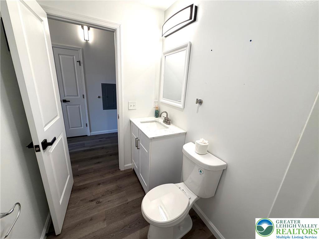 810 Monocacy Street, Unit 303 Bethlehem, PA 18018 - Photo 14 of 24 a bathroom with a sink a toilet a mirror and vanity