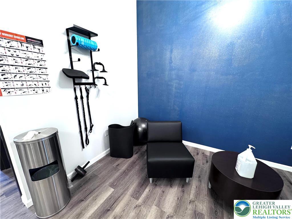 810 Monocacy Street, Unit 303 Bethlehem, PA 18018 - Photo 21 of 24 a living room with furniture and a wooden floor