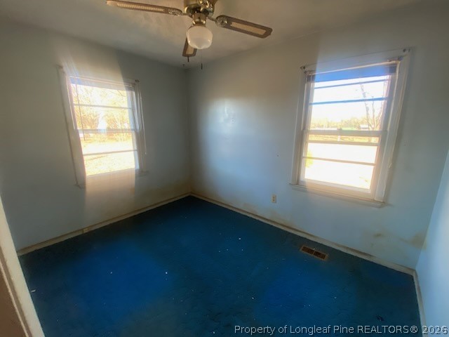 2771 Bailey Road Fairmont, NC 28340 - Photo 7 of 10 a view of an empty room with a window