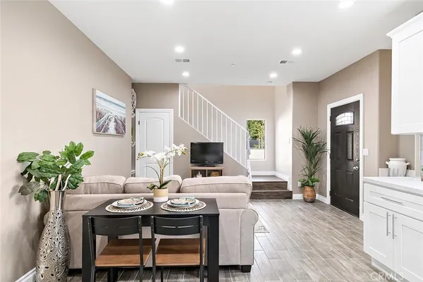 a view of a dining room with furniture and wooden floor
