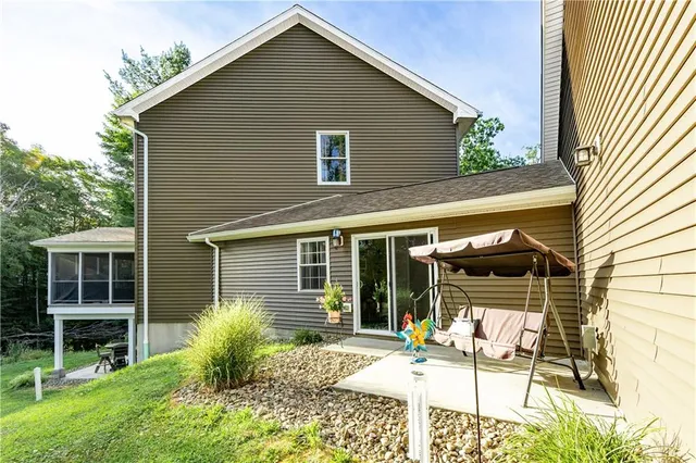 a backyard of a house with seating space
