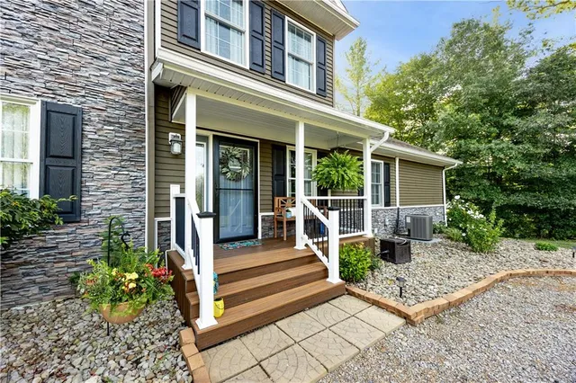 a front view of a house with a porch