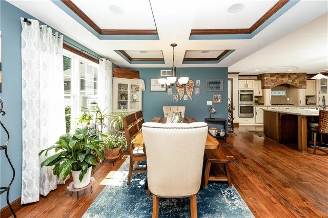 a kitchen with a table and chairs in it