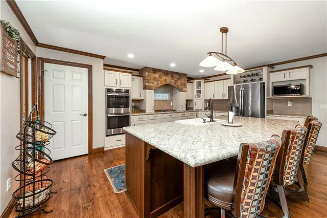 a kitchen with counter top space and stainless steel appliances