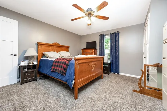 a bathroom with a toilet a sink and a mirror