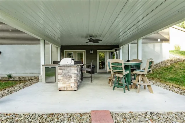 a dining room with furniture and a chandelier