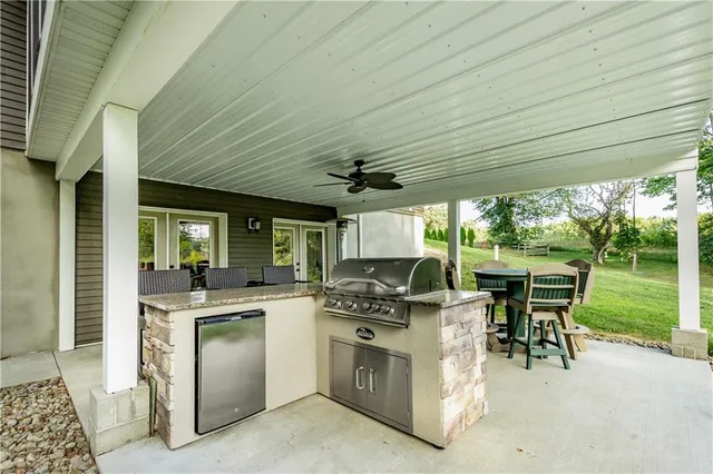 a kitchen with a stove kitchen island a sink and a stove