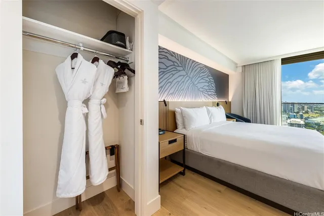 a bedroom with a bed and a mirror