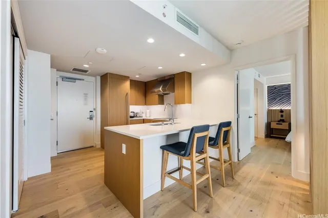 a kitchen with a table and chairs in it