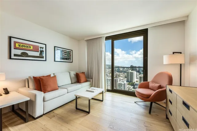 a living room with furniture and a large window