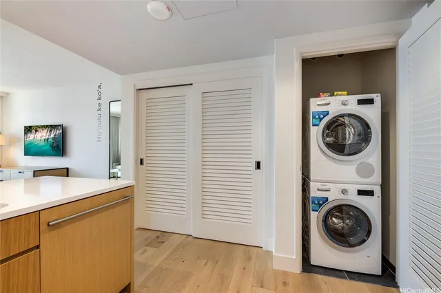 a utility room with sink dryer and washer