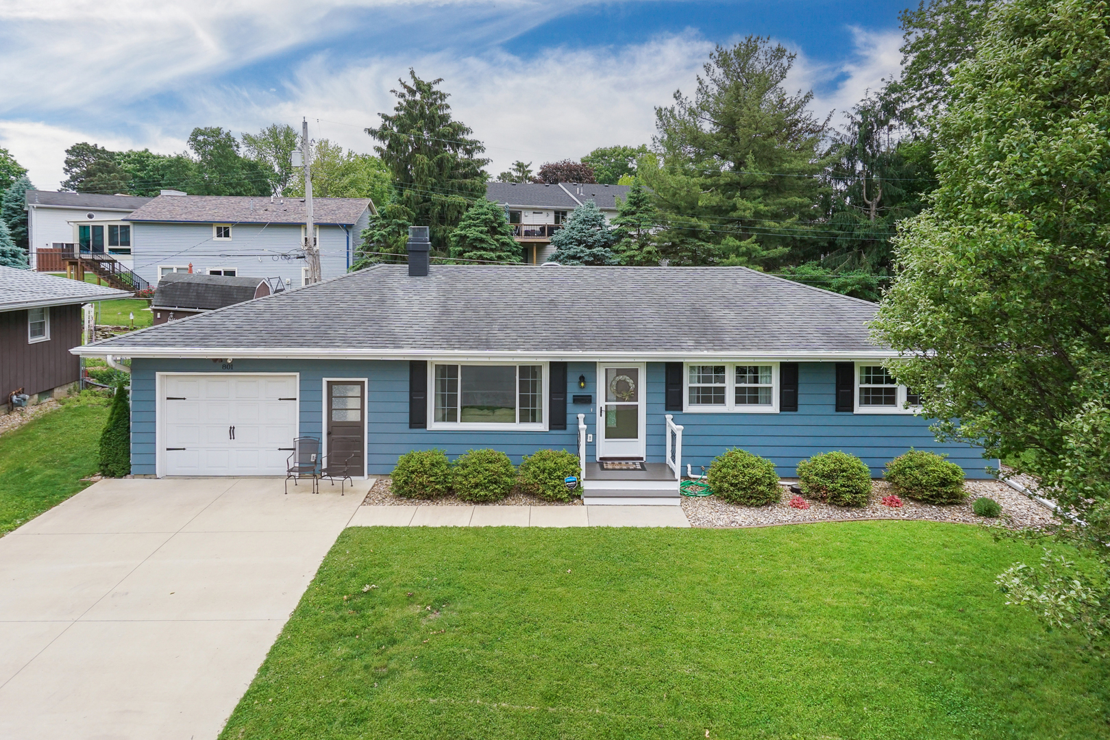 801 Spear Drive Normal, IL 61761 - Photo 41 of 41 a front view of a house with a garden and trees