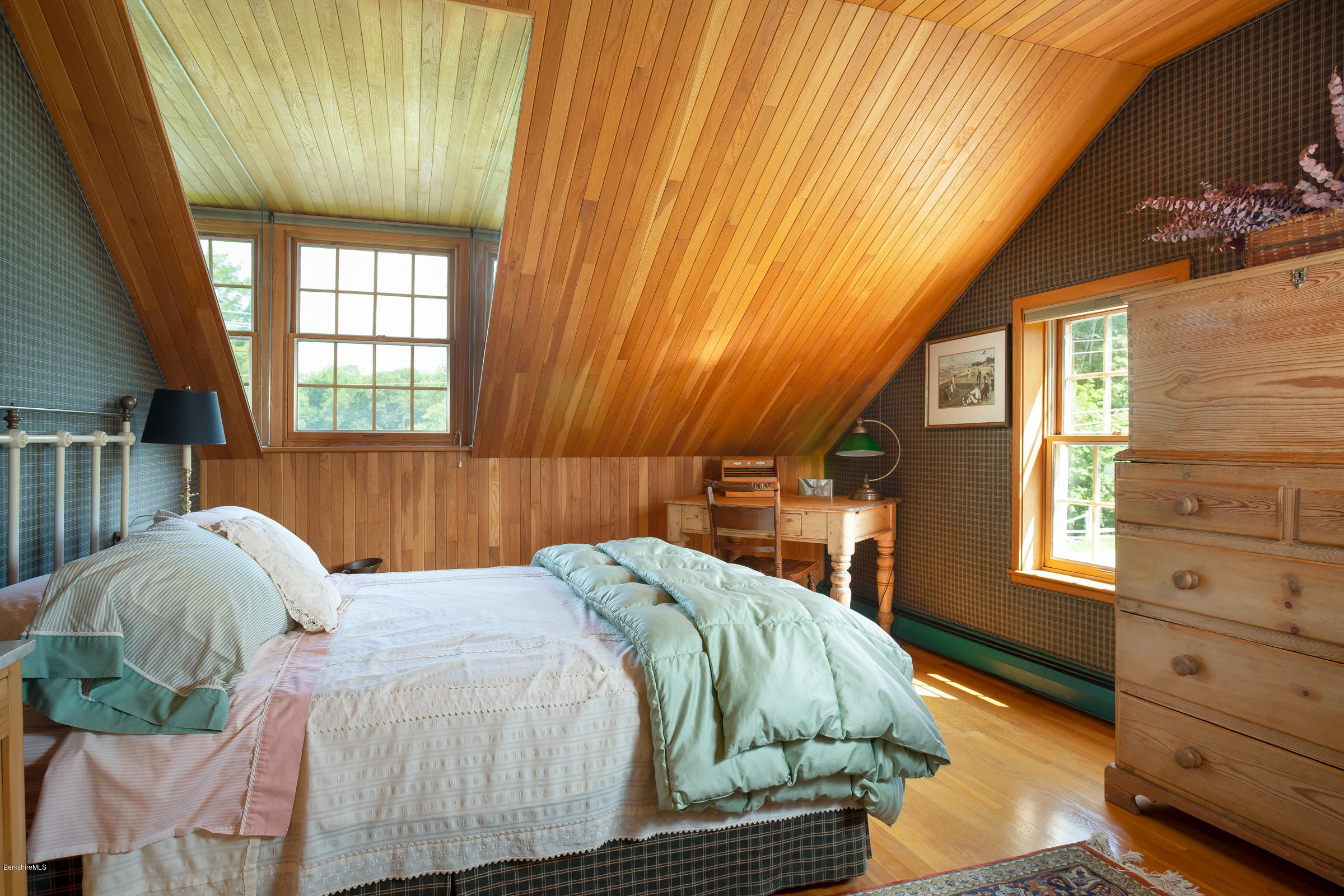825 Hancock Road Williamstown, MA 01267 - Photo 22 of 42 a bed sitting in a bedroom next to a window