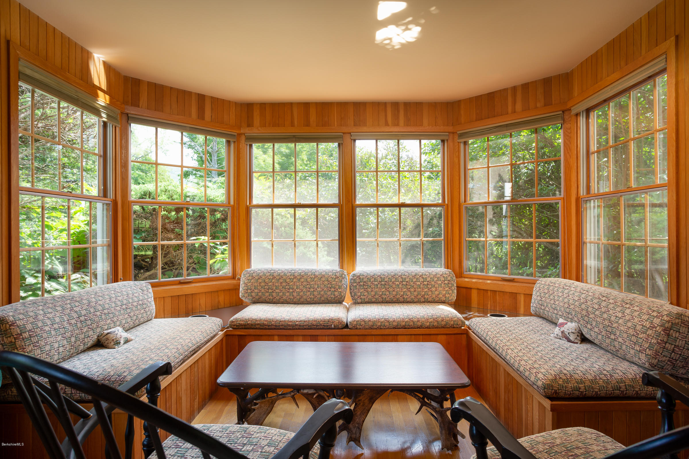 825 Hancock Road Williamstown, MA 01267 - Photo 8 of 42 a living room with furniture and a large window