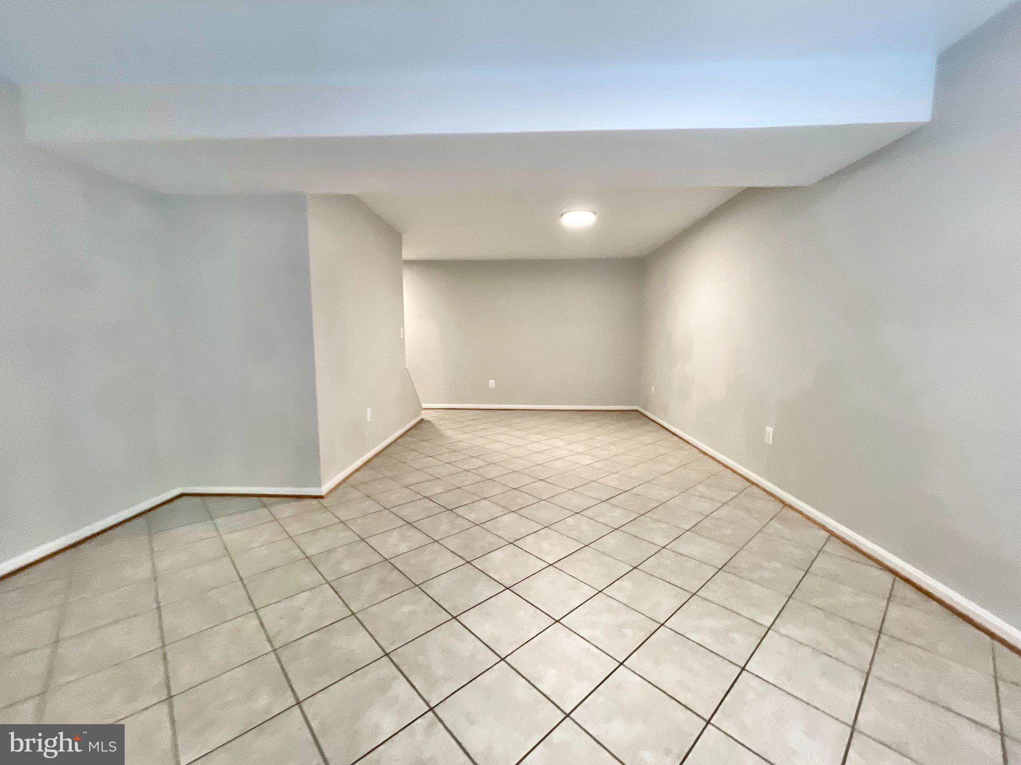 7925 Forest Path Way Springfield, VA 22153 - Photo 23 of 27 Spacious walk out basement w/ tile floors