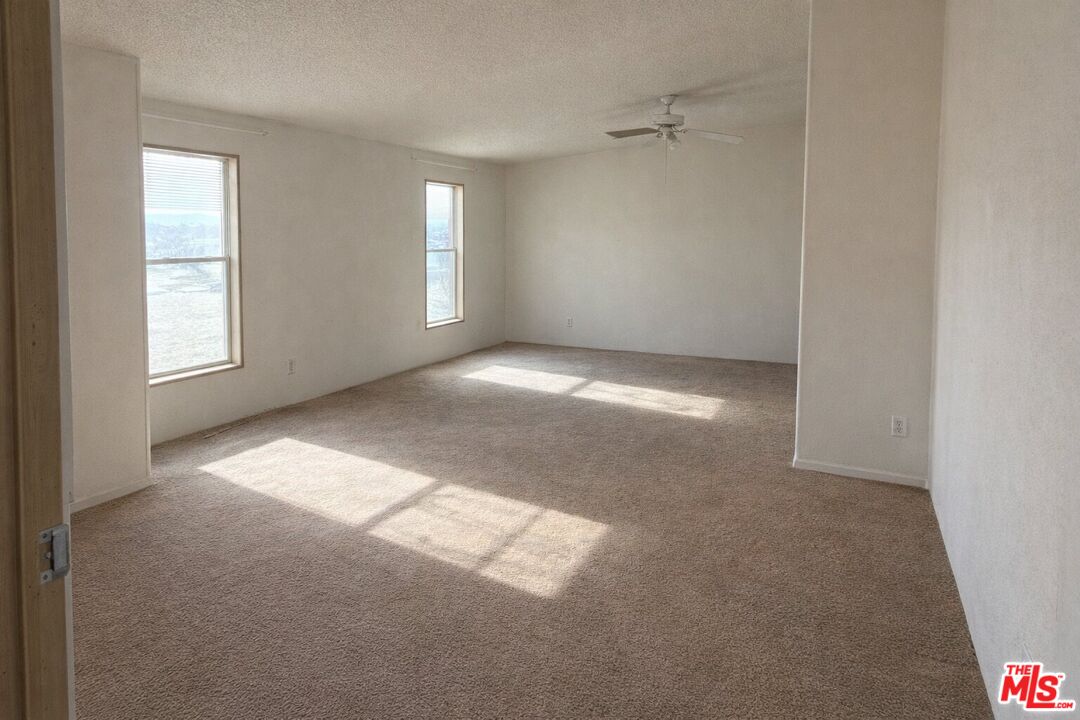 6288 Maricopa Road Phelan, CA 92371 - Photo 14 of 17 an empty room with windows