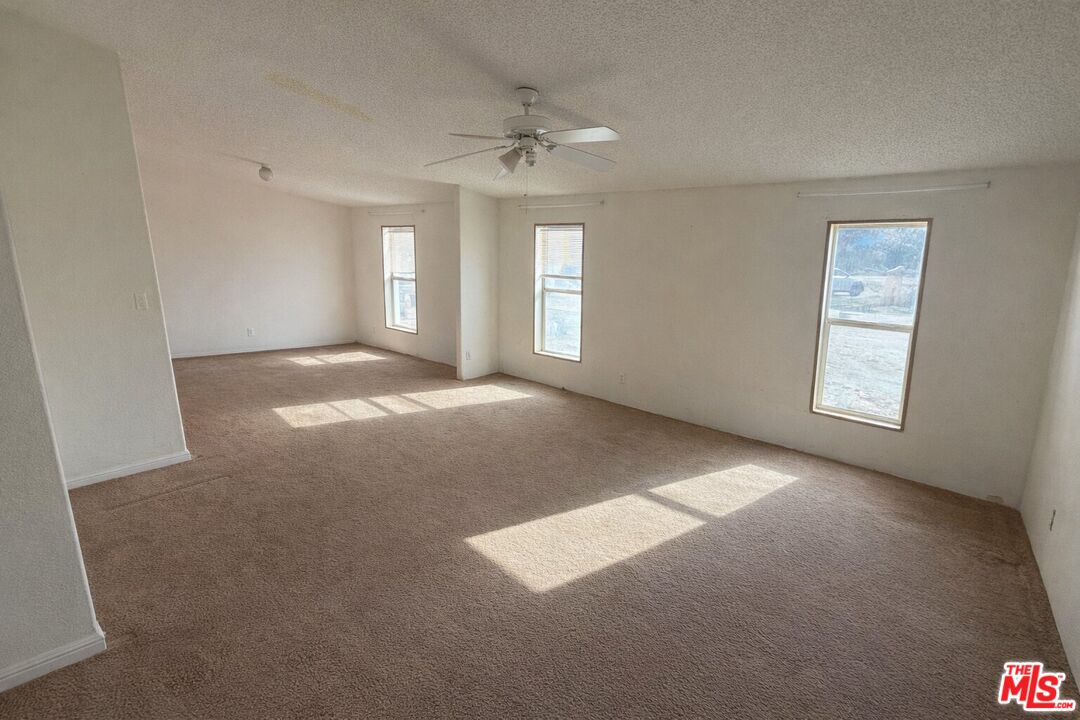 6288 Maricopa Road Phelan, CA 92371 - Photo 15 of 17 a view of an empty room with a window