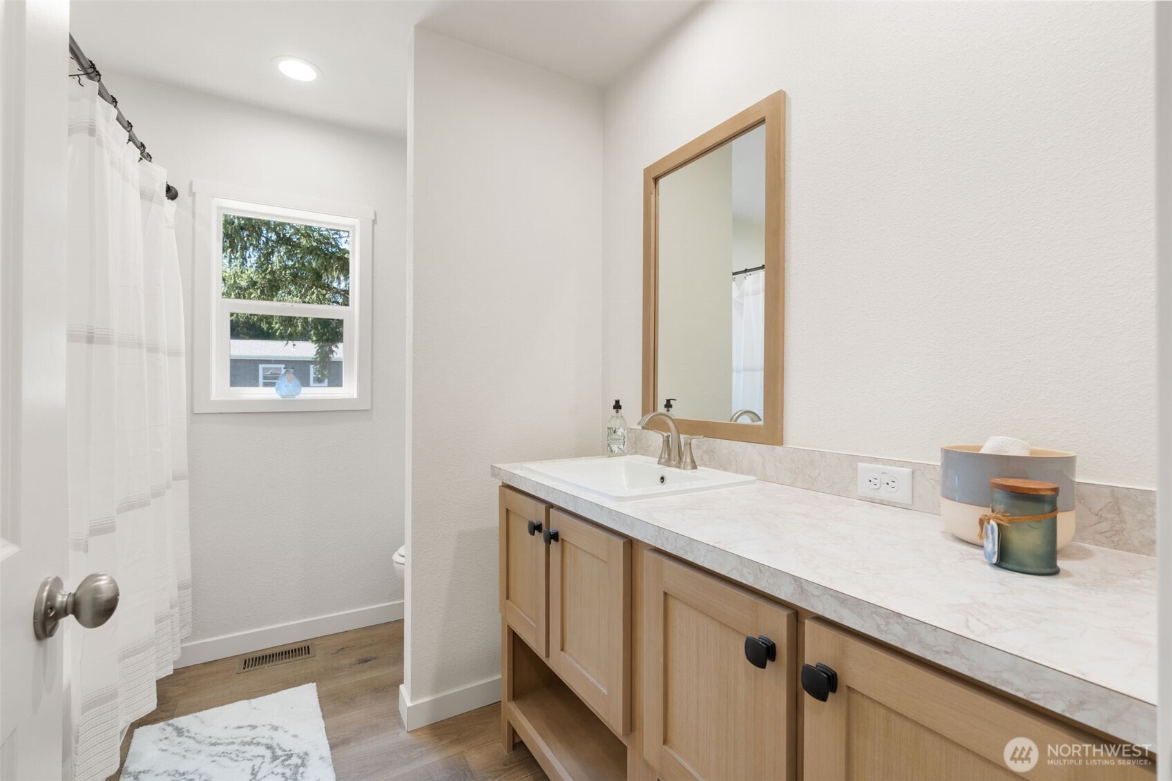 1090 Koontz Road Chehalis, WA 98532 - Photo 17 of 35 a bathroom with a sink a mirror and a window