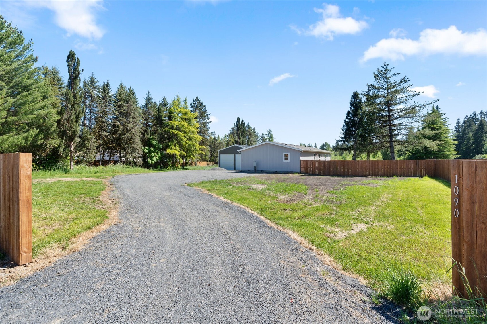 1090 Koontz Road Chehalis, WA 98532 - Photo 2 of 35 a view of a garden with a building in the background