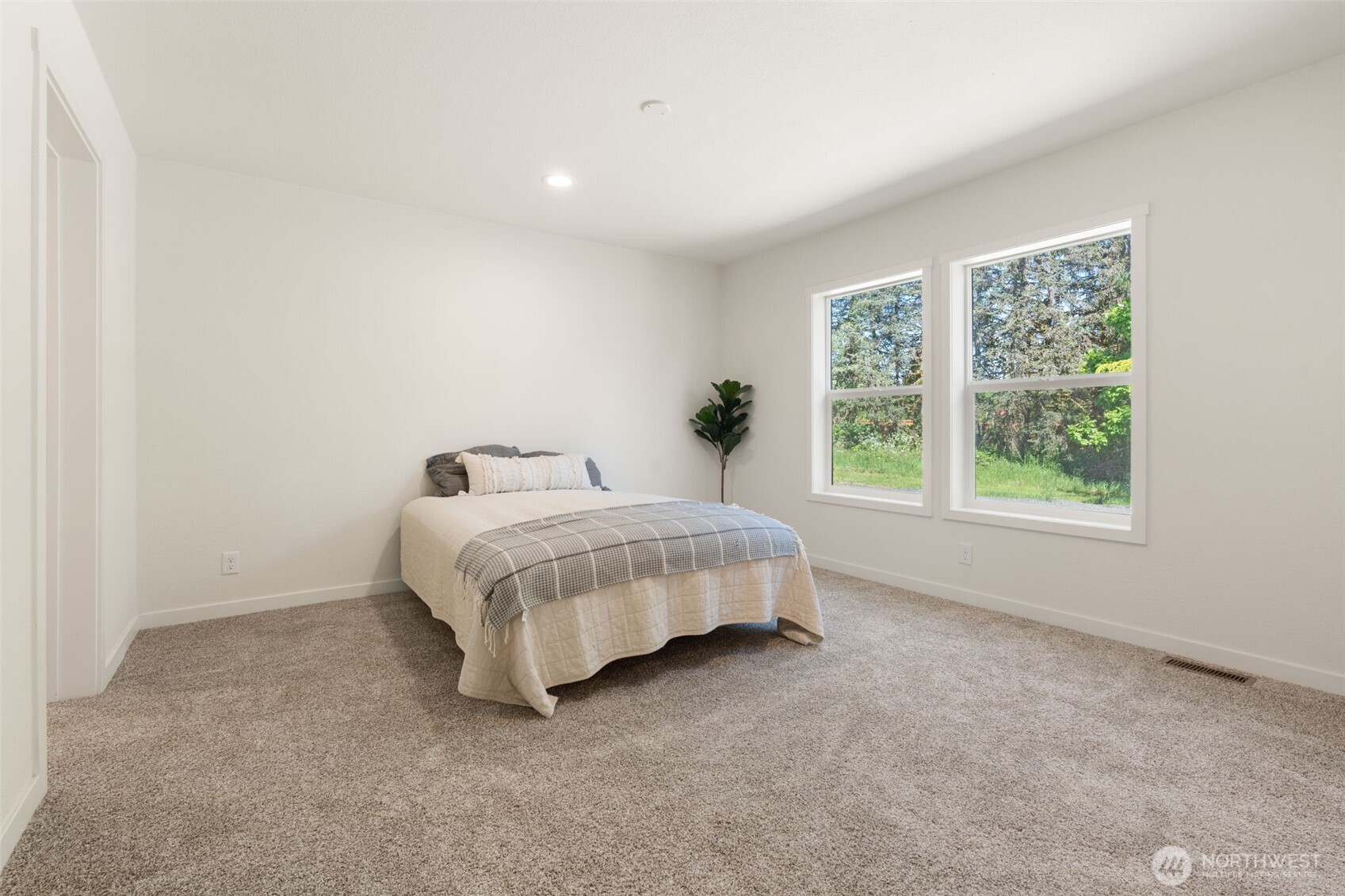 1090 Koontz Road Chehalis, WA 98532 - Photo 21 of 35 a bed sitting in a spacious bedroom next to a window