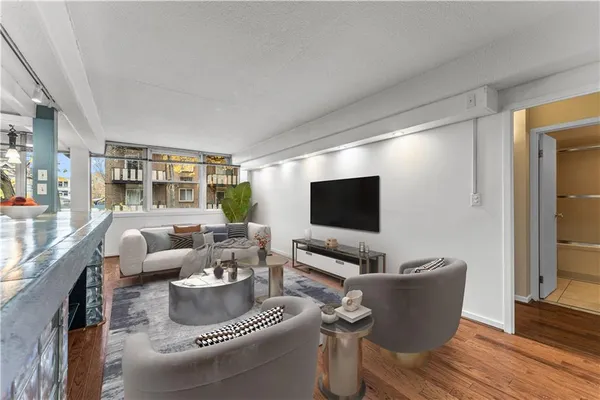 a living room with furniture and a flat screen tv