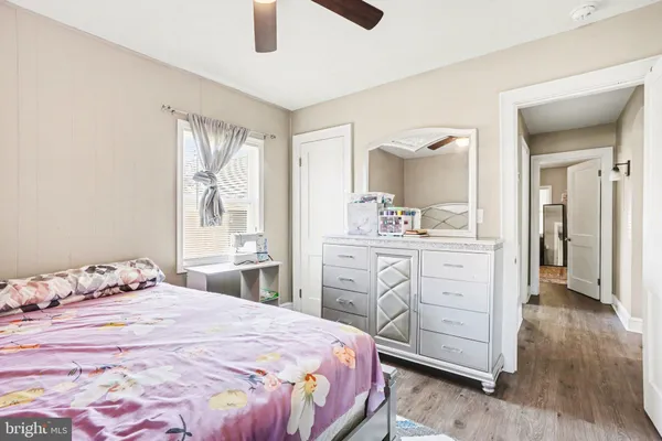 a bedroom with a bed and a dresser