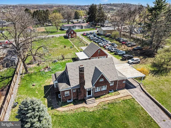 an aerial view of house with yard