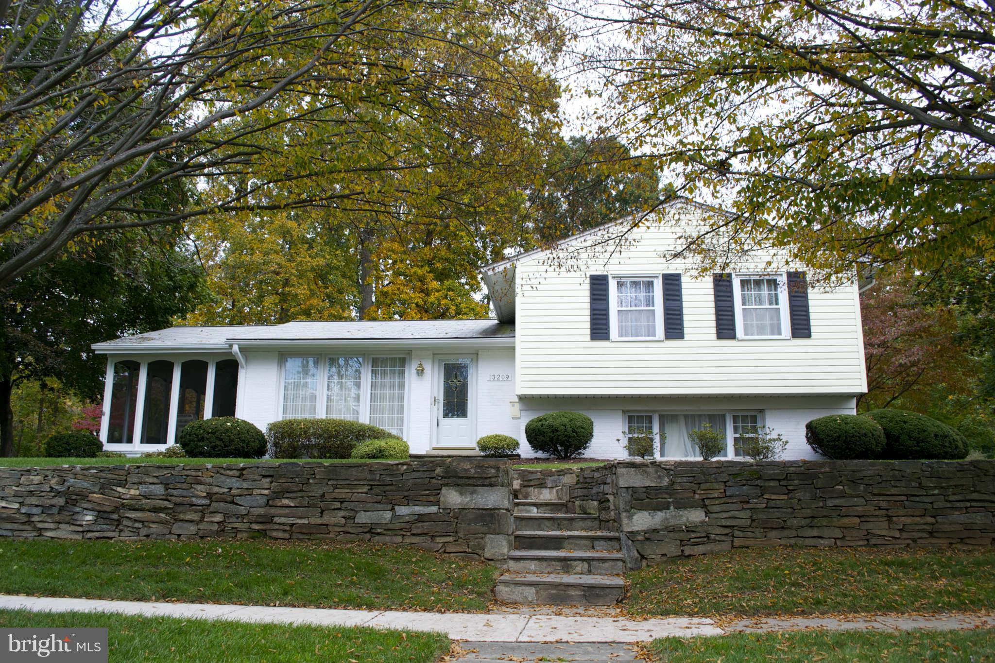 13209 Holdridge Road Silver Spring, MD 20906 - Photo 1 of 18 a front view of a house with garden