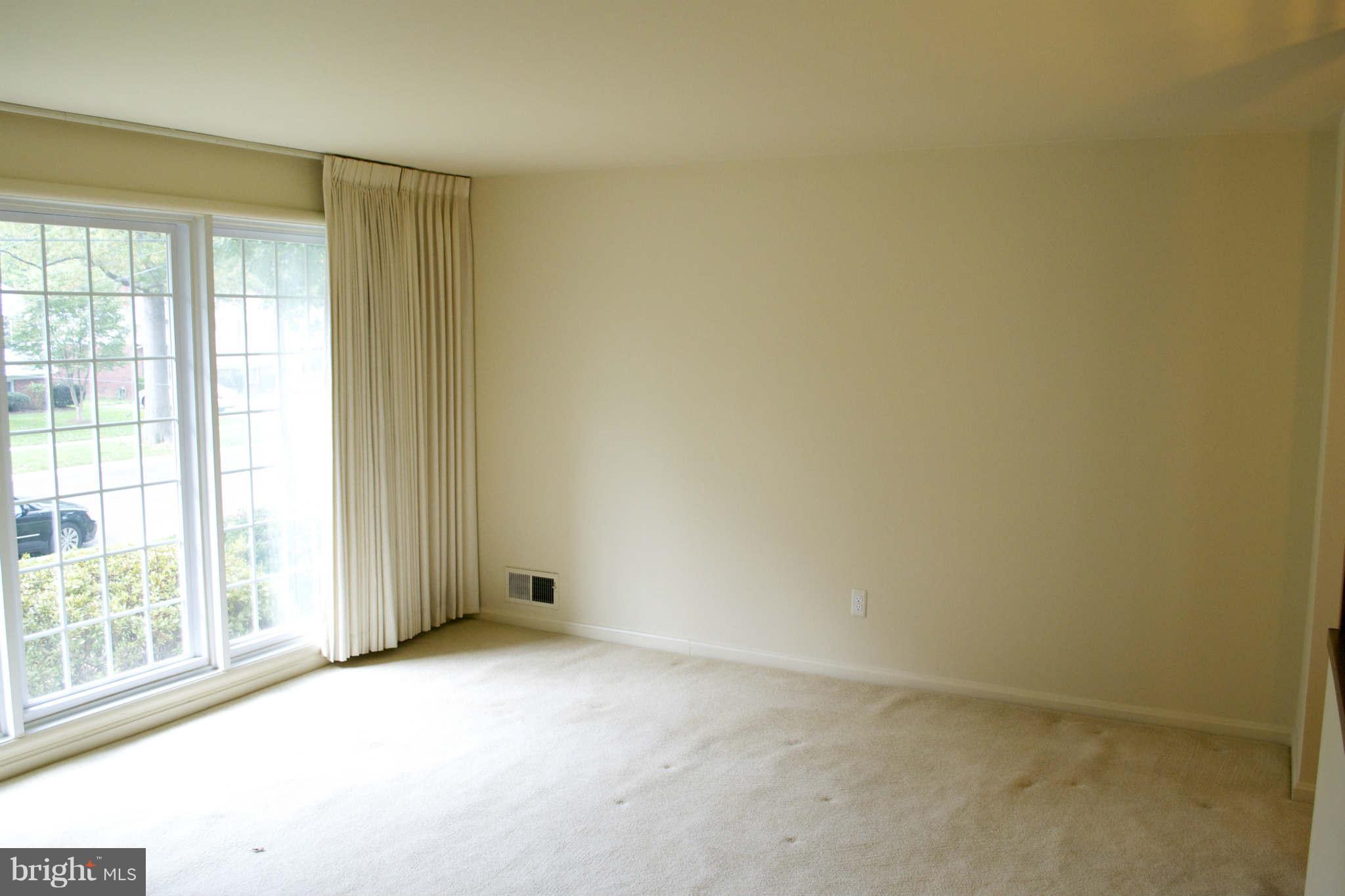 13209 Holdridge Road Silver Spring, MD 20906 - Photo 2 of 18 an empty room with a window