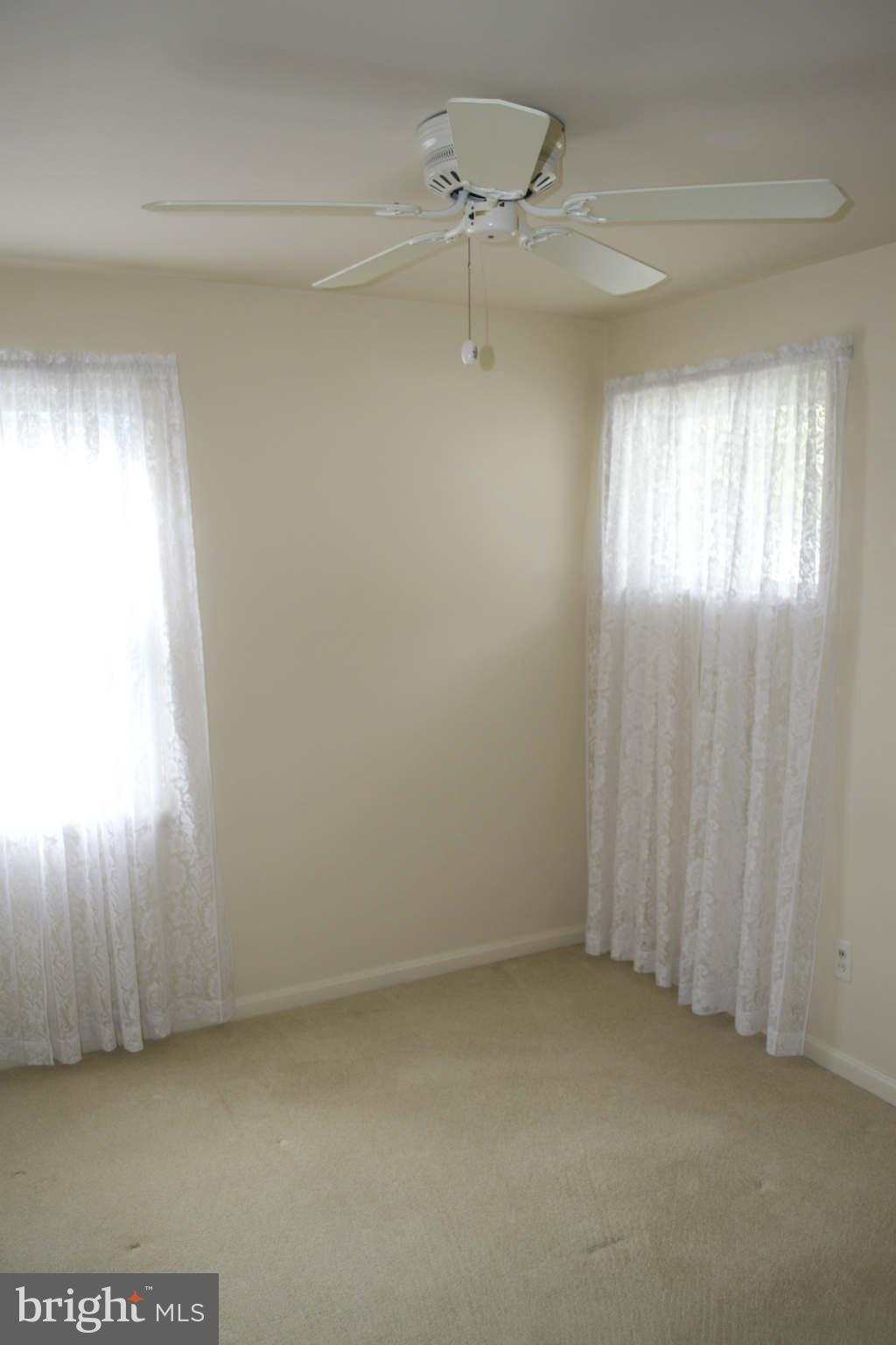 13209 Holdridge Road Silver Spring, MD 20906 - Photo 11 of 18 a view of an empty room and window