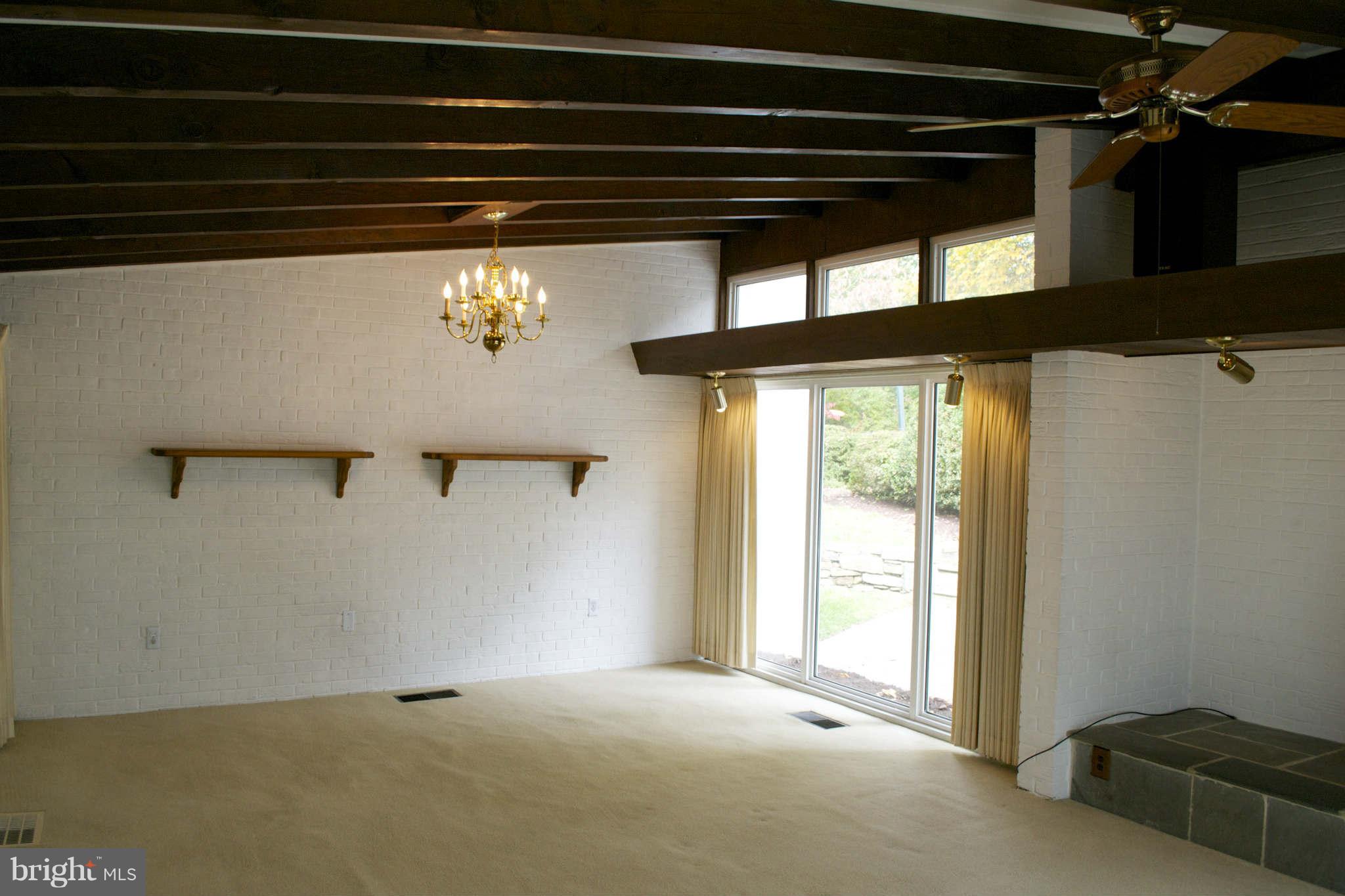 13209 Holdridge Road Silver Spring, MD 20906 - Photo 5 of 18 a view of empty room with windows
