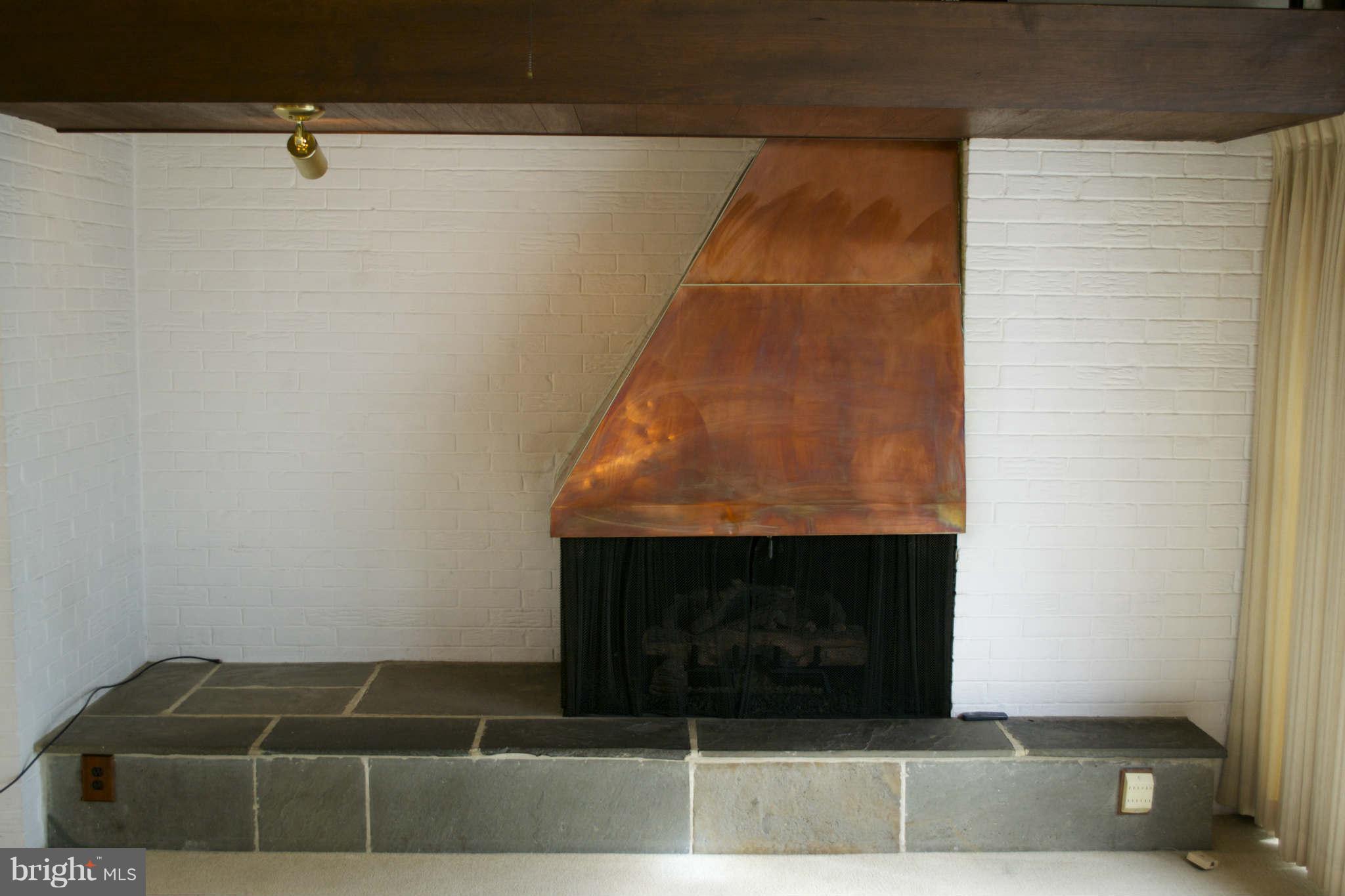 13209 Holdridge Road Silver Spring, MD 20906 - Photo 7 of 18 a room with fireplace