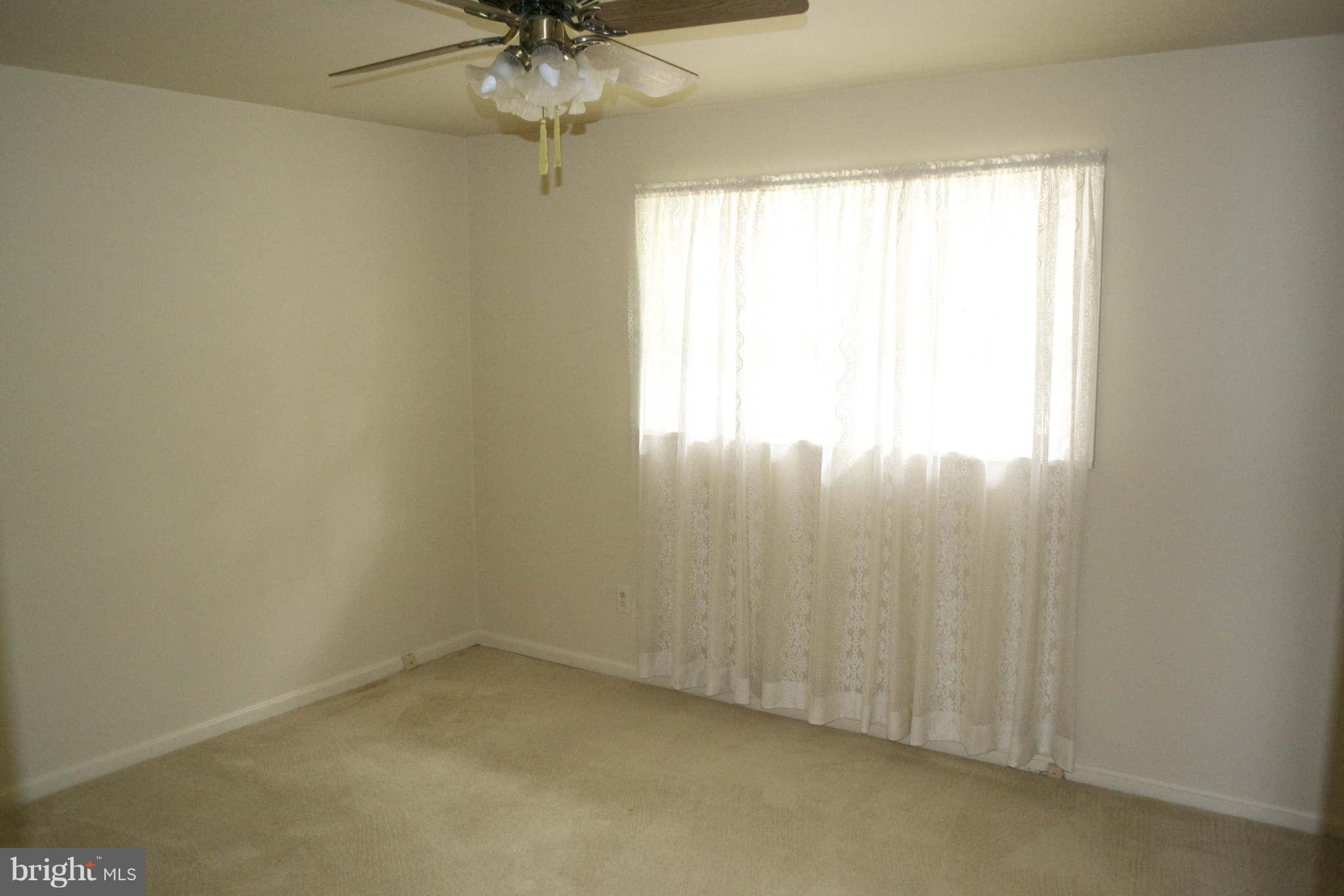 13209 Holdridge Road Silver Spring, MD 20906 - Photo 9 of 18 an empty room with a window