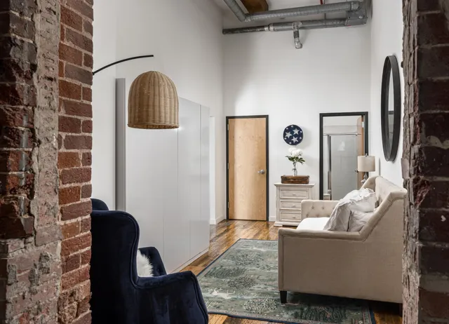 a living room with furniture and a window