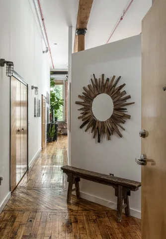 a room with furniture and a potted plant